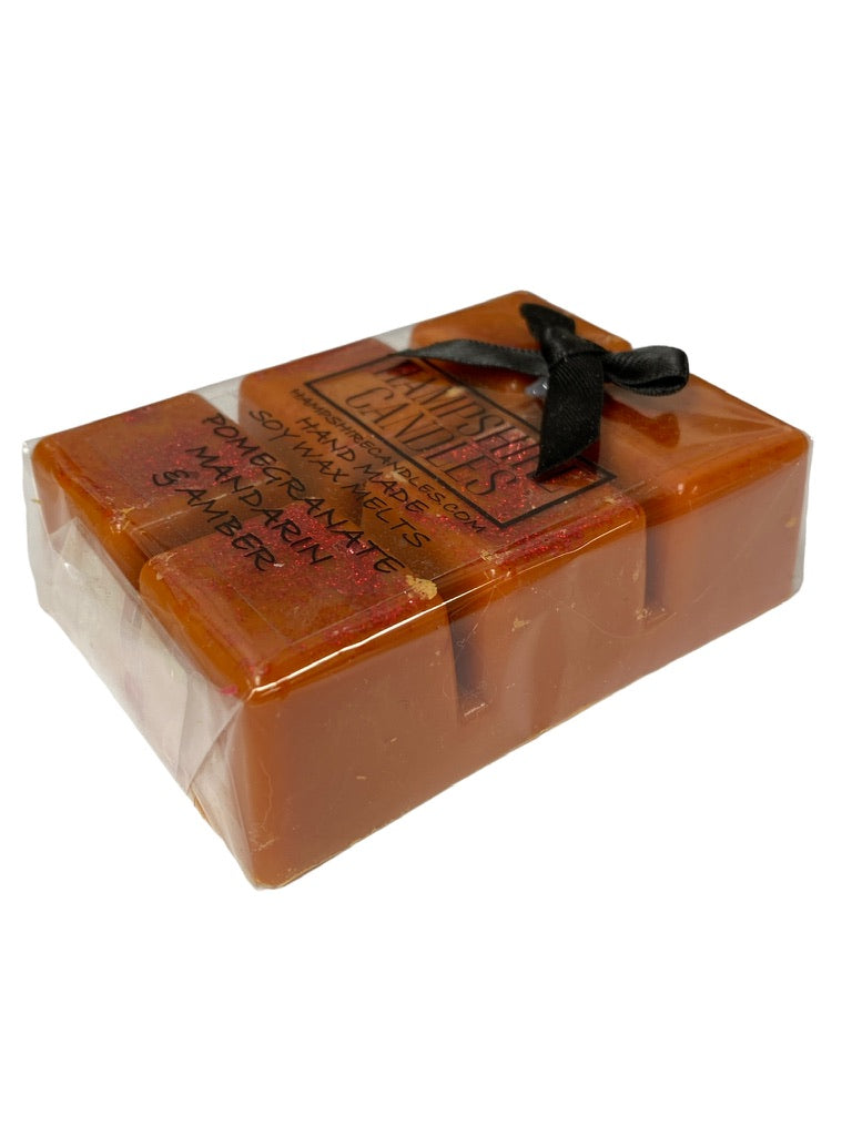 Soy wax melts with pomegranate, mandarin, and amber fragrance. Ideal for electric wax melt burners and creating a refreshing, fruity atmosphere.