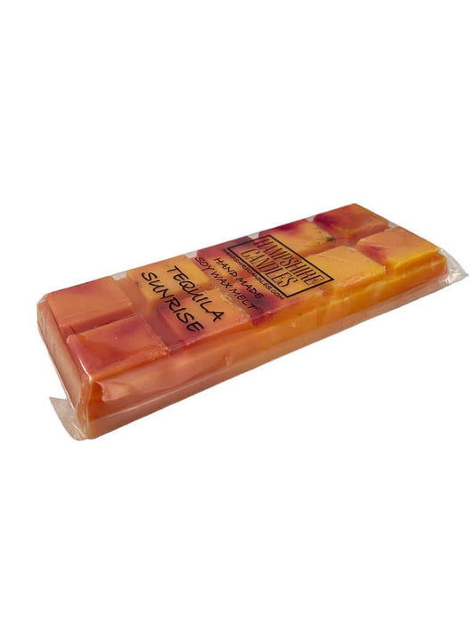 Tequila Sunrise Wax Melts with a vibrant citrus and tropical fruit fragrance, delivering an energizing scent reminiscent of a refreshing cocktail. Ideal for wax melt warmers