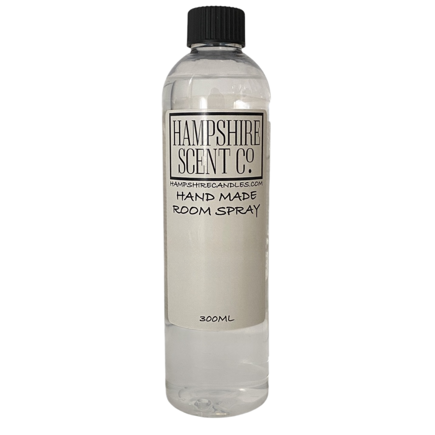 Room spray displayed in a warm, romantic setting with floral touches.