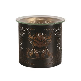 Black & Gold Highland Cow Wax Melter (10.5cm) in use as a wax melter, with wax melts in the glass dish and a tealight glowing inside.