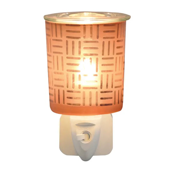 Copper square plug-in wax melter fitted into a UK mains socket, showing glass dish and on/off switch, 13cm electric wax melt warmer