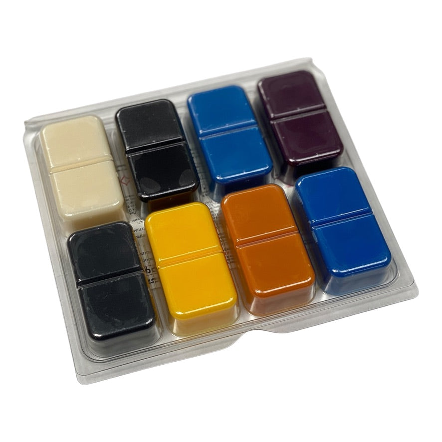 Close-up of luxury soy wax melts from the Perfume Collection by Hampshire Candles, showcasing fragrances like Flower Bomb, Angel, Good Girl, and more.