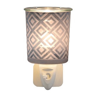 Wax Melter Plug-In – Blue Diamond (13cm) illuminated, casting a soft, ambient glow through its elegant diamond pattern.