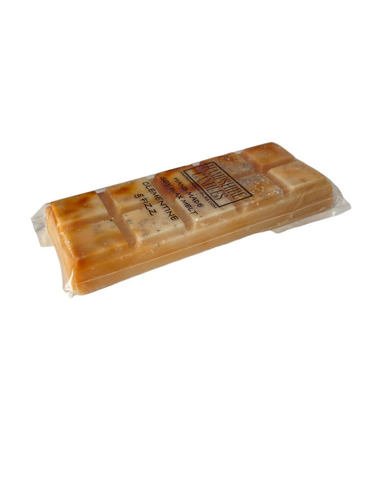 Clementine and Fizz Wax Melts with a zesty blend of fresh clementine and sparkling citrus fizz, perfect for a lively atmosphere in your home. Use with a wax melt burner.