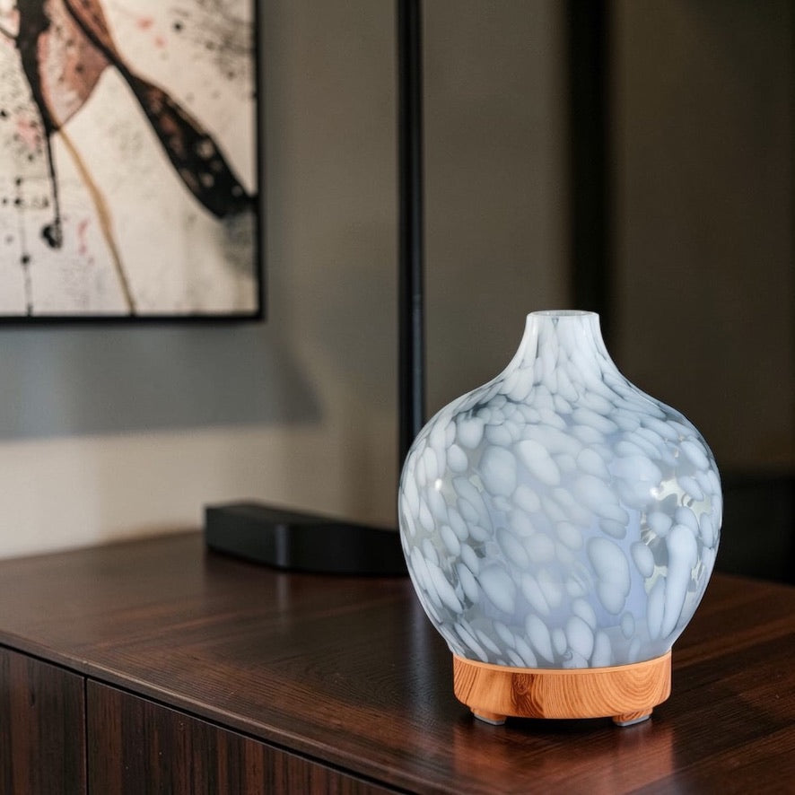 silver essential oil diffuser in home creating relaxing aromatherapy atmosphere
