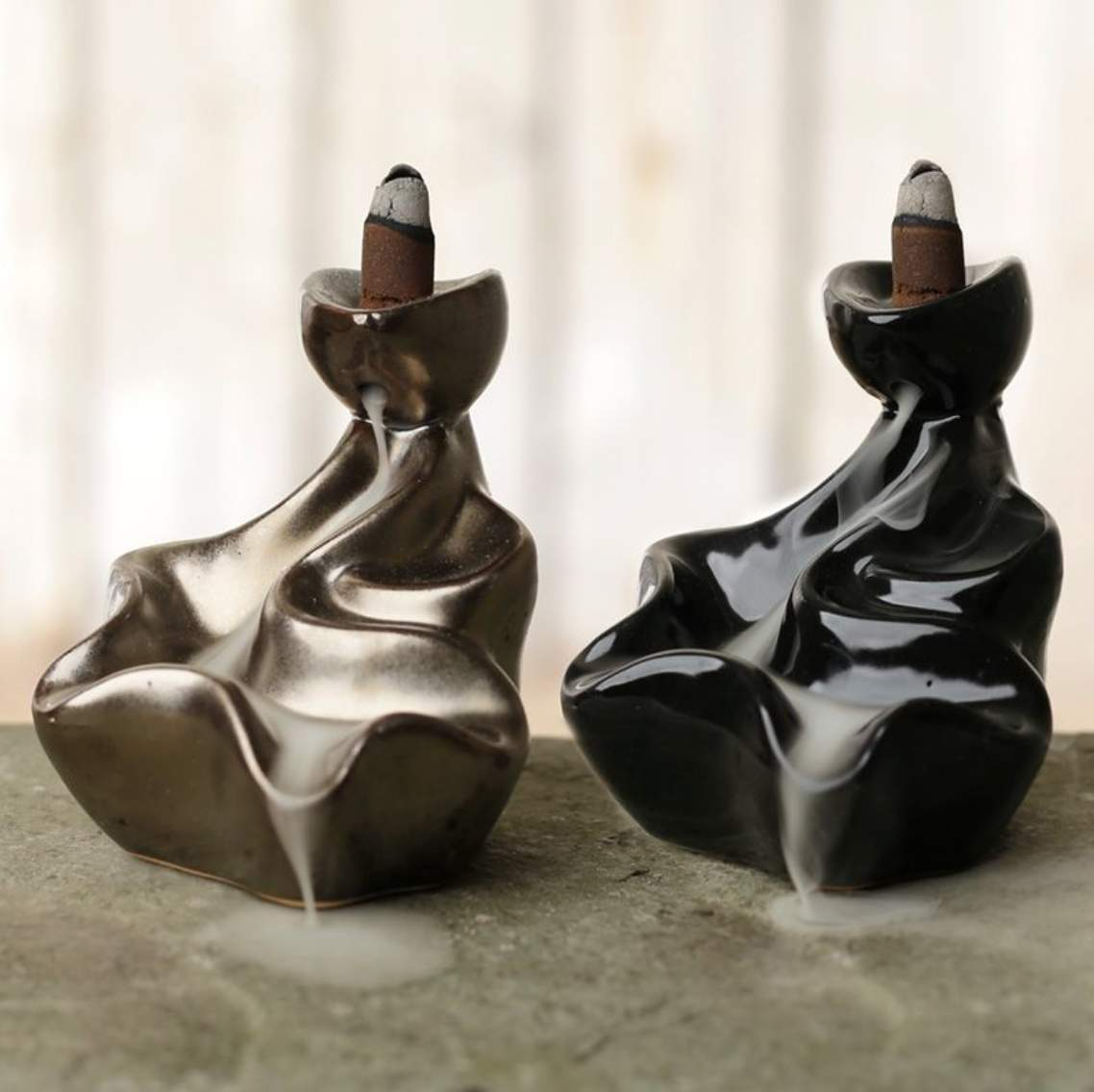 Black waterfall backflow incense burner with cascading smoke