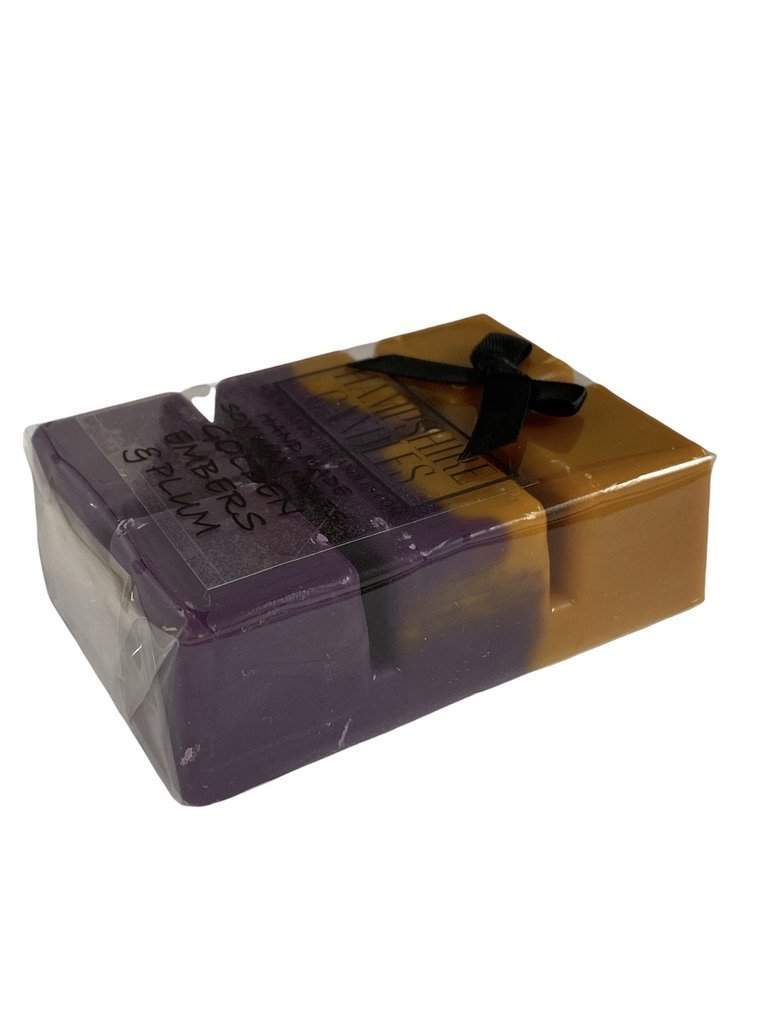 Soy wax melts with the deep, fruity scent of plum and golden embers. Ideal for electric wax melt burners, bringing warmth and elegance to your home.