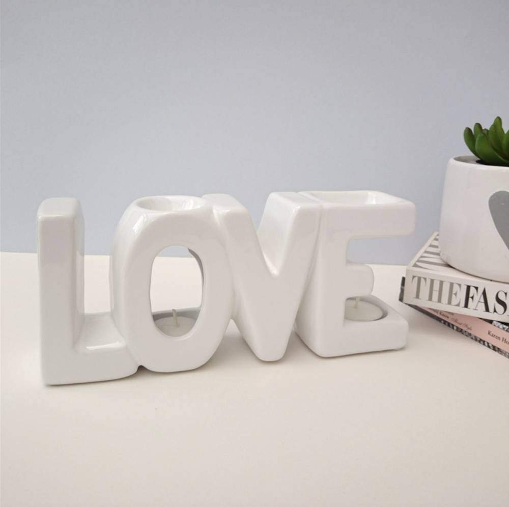 LOVE-shaped ceramic wax melt burner with two wax pools above the letters O and E – stylish double wax burner and romantic home décor accessory