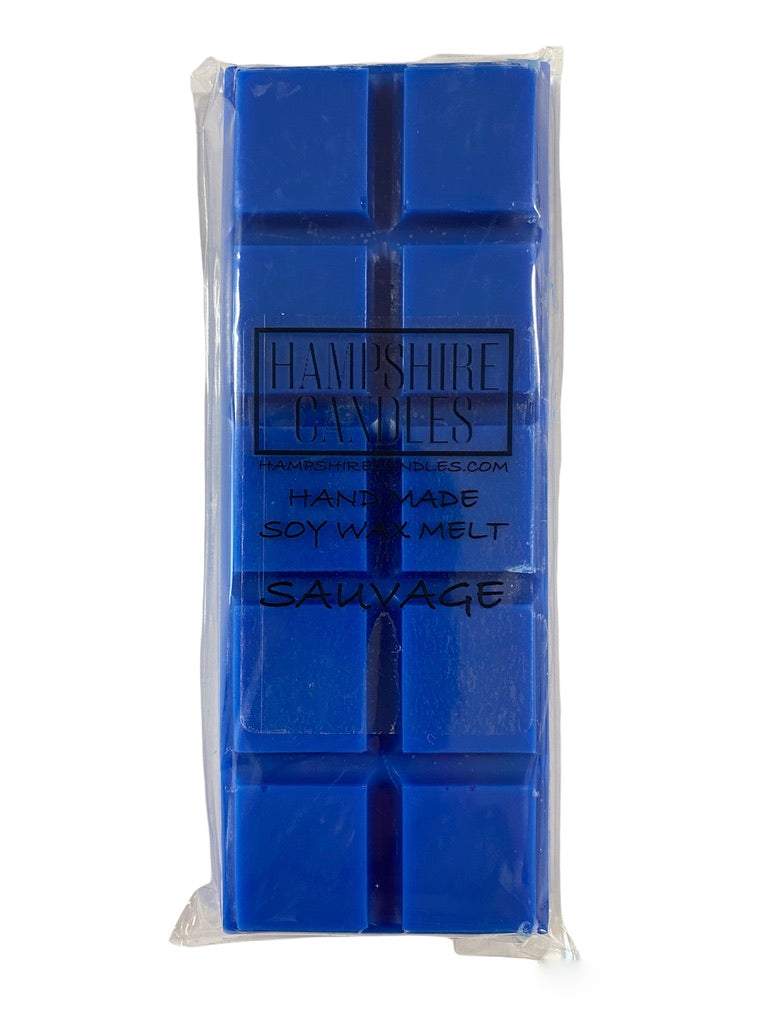 Hand-poured Sauvage scented wax melts placed beside a wax burner, ready to fill the room with a fresh, masculine aroma