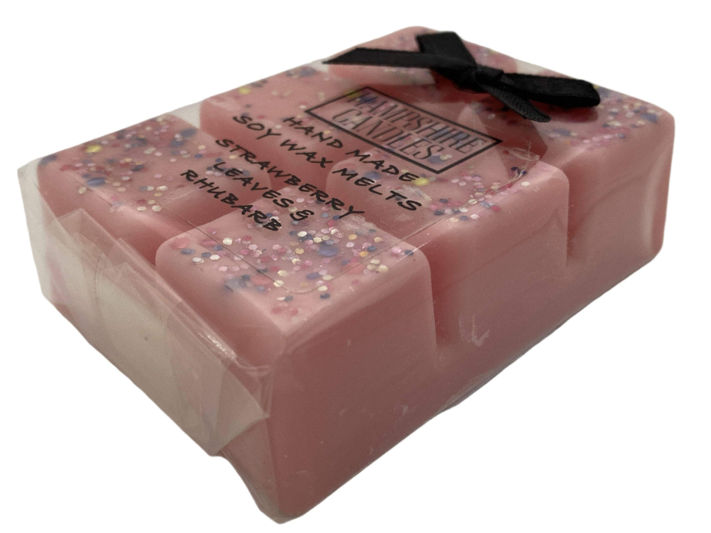 Strawberry Leaves & Rhubarb Wax Melts with Fresh Ingredients – A vibrant display featuring wax melts alongside fresh strawberries and rhubarb stalks.