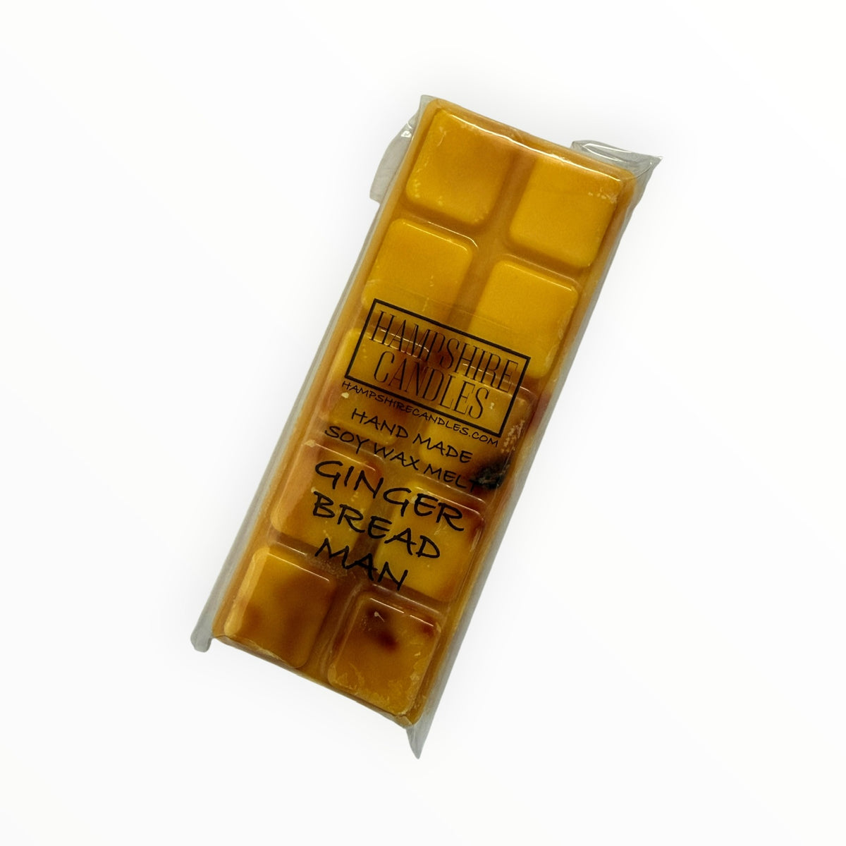 Gingerbread Man Mini Snap Bar soy wax melt in golden amber with dark brown speckles, in clear cellophane