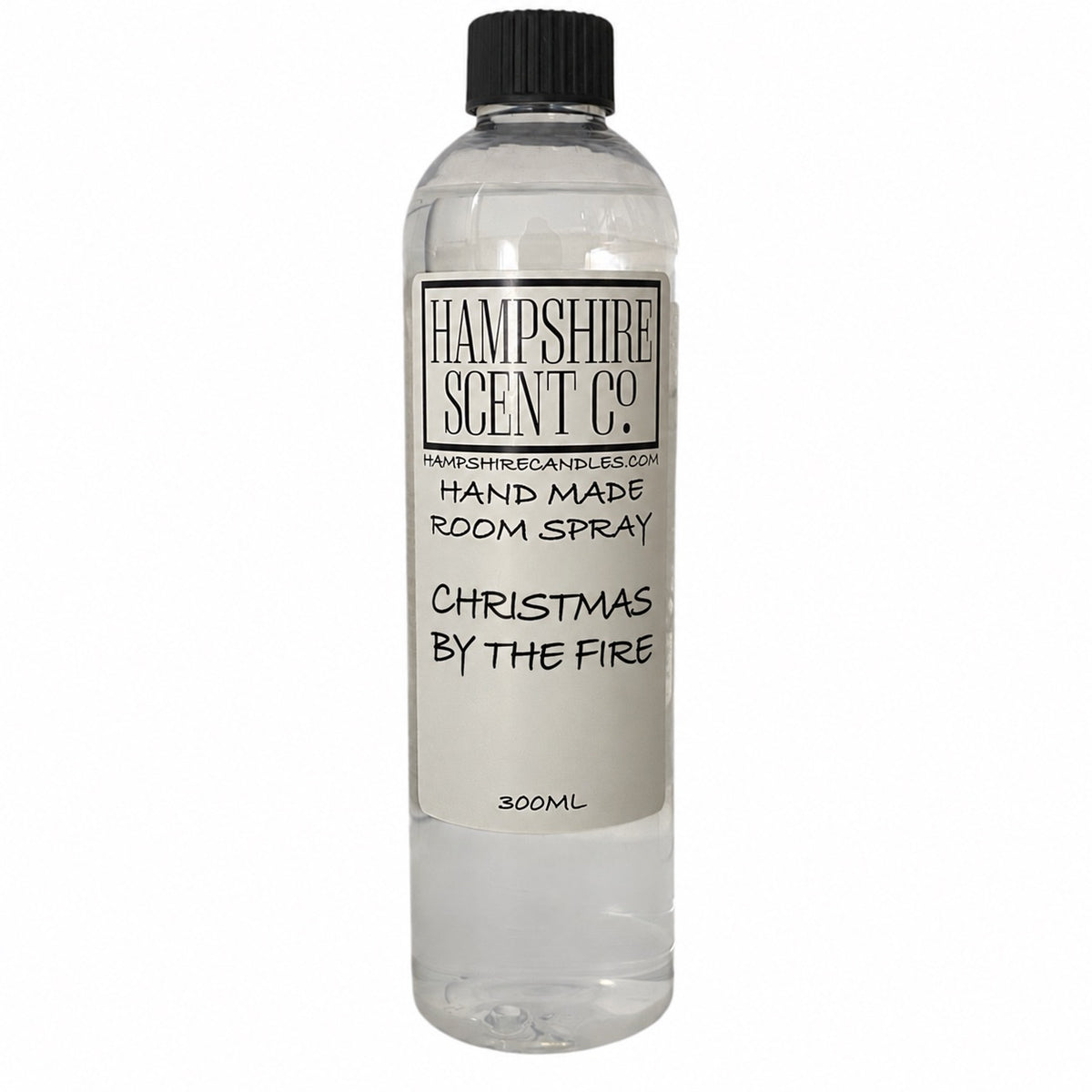 Hampshire Scent Co. Christmas By The Fire handmade room spray in a 300ml clear bottle with black screw cap