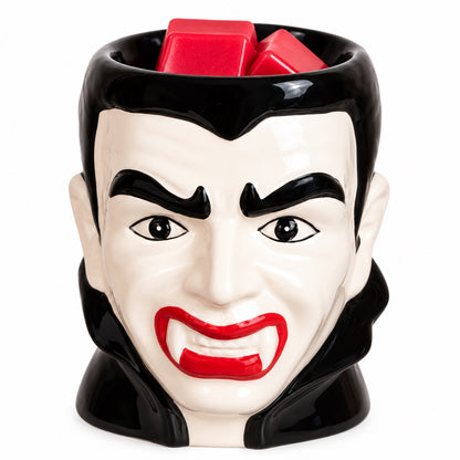 Dracula Halloween wax melt burner with red soy wax melts in the top dish