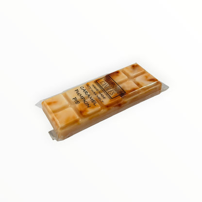 Caramel Pumpkin Pie Mini Snap Bar wax melt lying flat, showing the cream and caramel-brown swirled segments