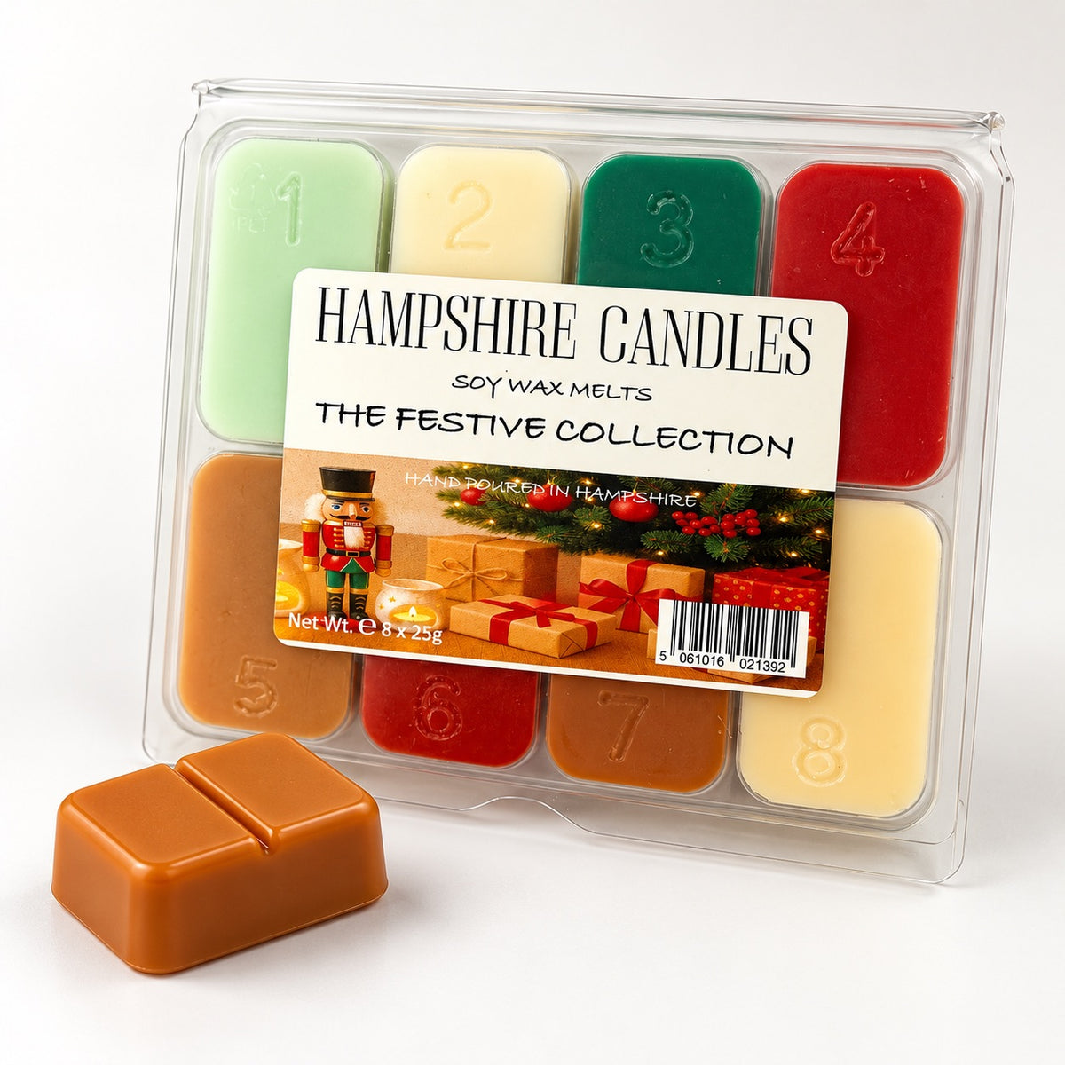 Festive Collection selection box with a nutcracker and presents on the label, plus one loose caramel snap melt in front