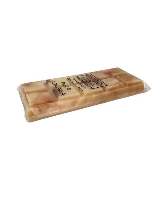 Pina Colada Wax Melts with a sweet tropical scent of coconut and pineapple, perfect for creating a beachy, vacation-inspired atmosphere. Soy wax melts for a summery fragrance
