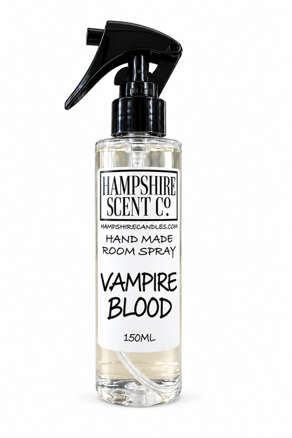 A 150ml clear spray bottle of Hampshire Scent Co. 'Vampire Blood' hand made room spray, featuring a black trigger spray nozzle and a white label with black text, set against a plain white background.