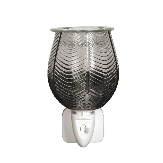 Add fragrance and style to your home with the Ribbed Grey Lustre Plug-In Wax Melt Burner. Elegant textured glass design with bulbs and dishes included.
