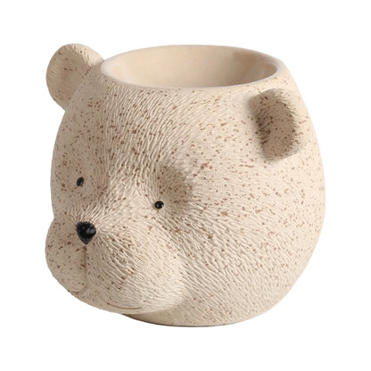 Bear tealight wax melt burner displayed in a cosy home setting while warming scented wax melts in the top dish.