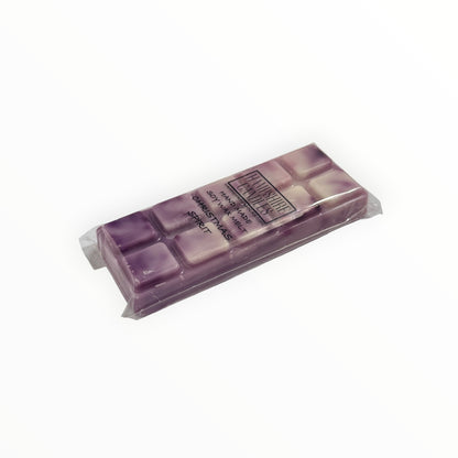 Christmas Spirit Mini Snap Bar wax melt lying flat, showing the purple and cream marbled segments