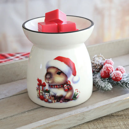 Christmas Capybara tealight wax melt burner displayed with festive decorations while warming scented Christmas wax melts.