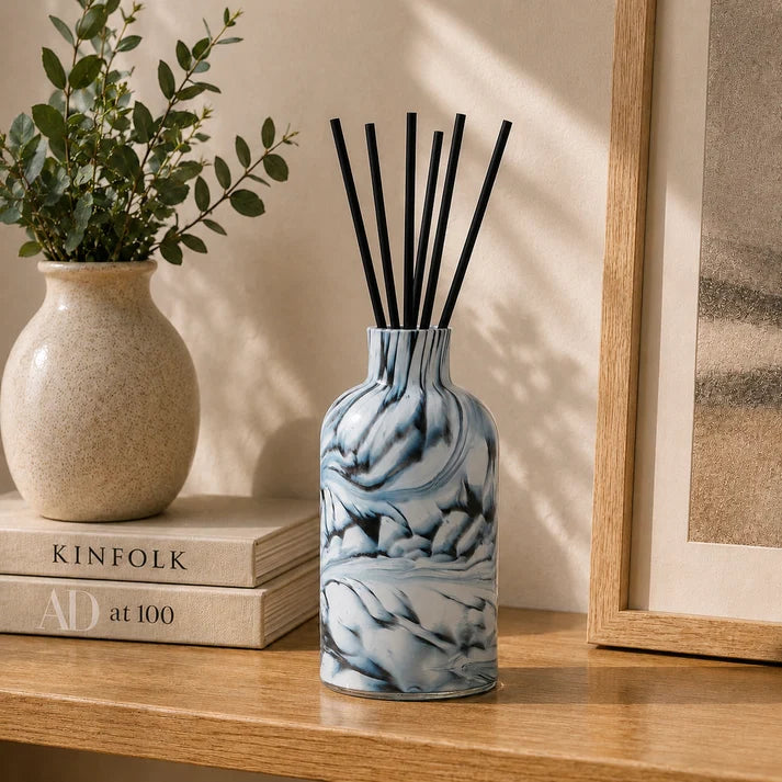 Close-up of Forme Smoke Reed Diffuser showing the distinctive smoky grey, black and polished stone-inspired finish.