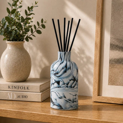 Close-up of Forme Smoke Reed Diffuser showing the distinctive smoky grey, black and polished stone-inspired finish.