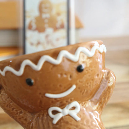 GingerbreadClose-up of Gingerbread Christmas wax melt burner showing the textured biscuit-style finish, white icing details and festive design.