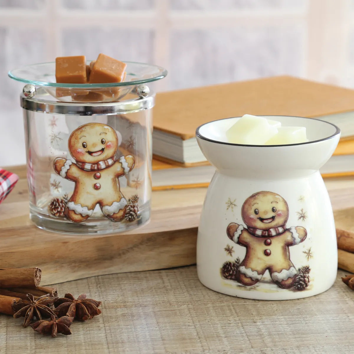 Close-up of Gingerbread Christmas wax melt burner with clear glass body, chrome-effect frame and removable glass wax dish.