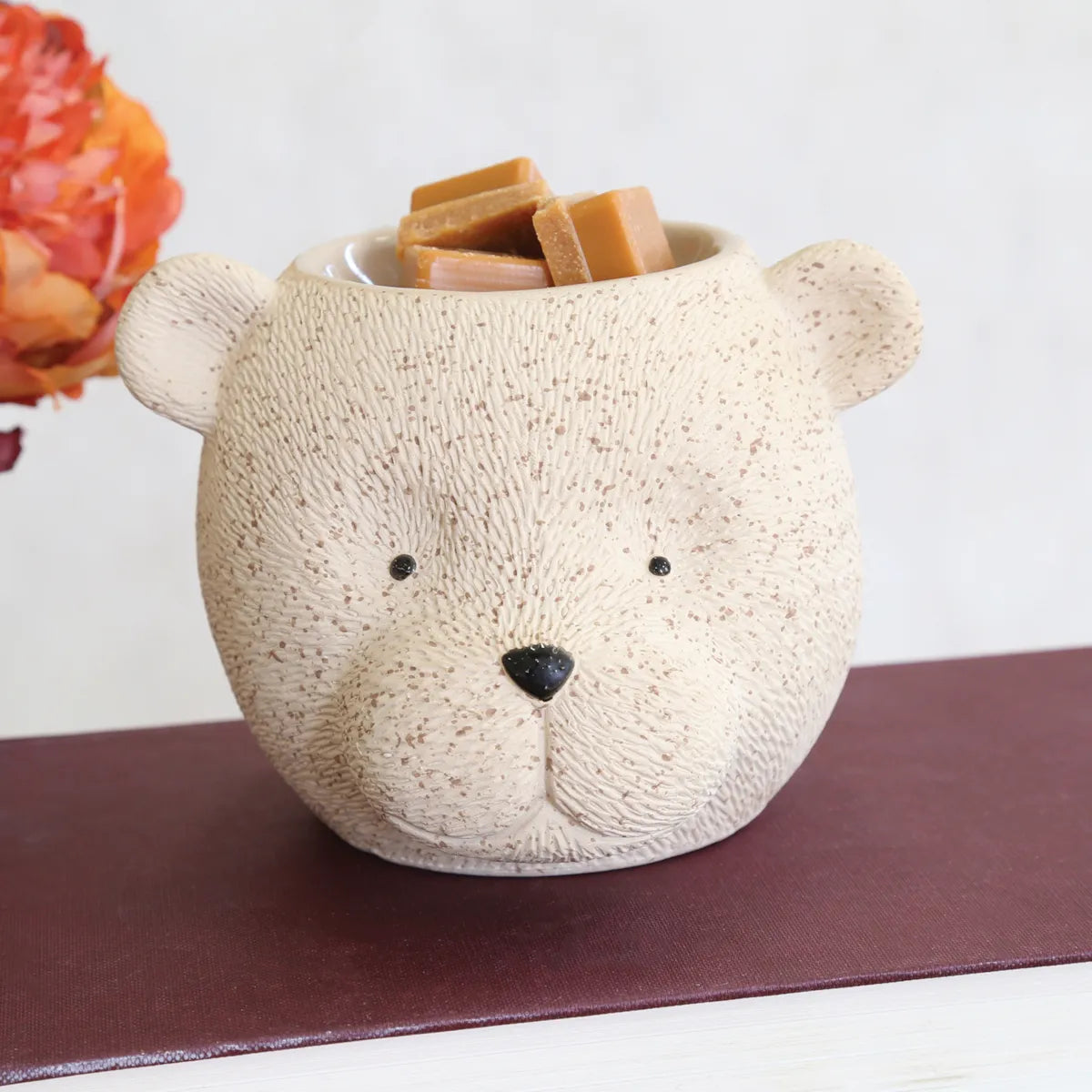 Close-up of cute Bear Wax Melt Burner showing the speckled cream finish, textured bear design and open wax melt dish.