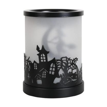 Decorative Halloween witch electric wax melt burner creating cosy seasonal home fragrance