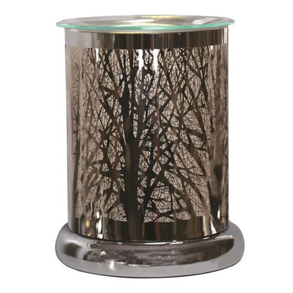 Decorative silver forest electric wax warmer illuminated with warm ambient glow