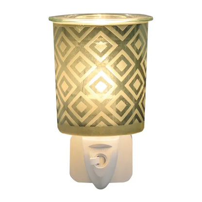 Green diamond plug-in wax melter fitted into a UK mains socket showing glass dish and on/off switch, 13cm electric wax melt warmer
