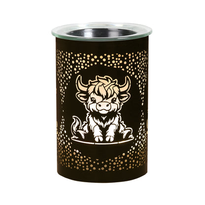 Highland cow wax melt burner in living room with soft LED glow home fragrance