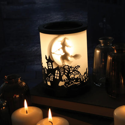 Illuminated witch electric wax warmer with village cut-out design for soy wax melts