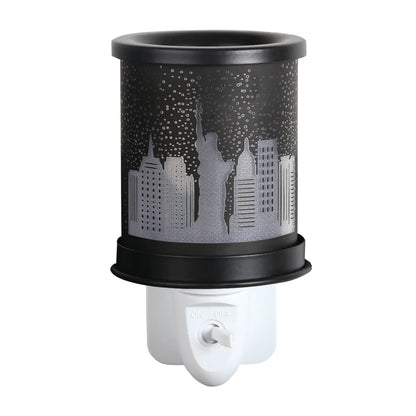 Modern New York silhouette electric wax melt burner with glass dish and warm glow