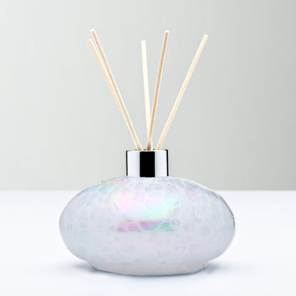 White decorative reed diffuser bottle in mouth-blown glass