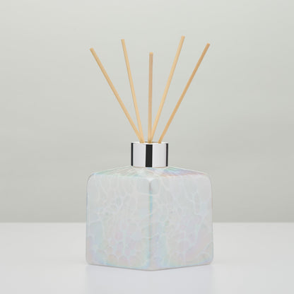White decorative reed diffuser bottle in mouth-blown glass
