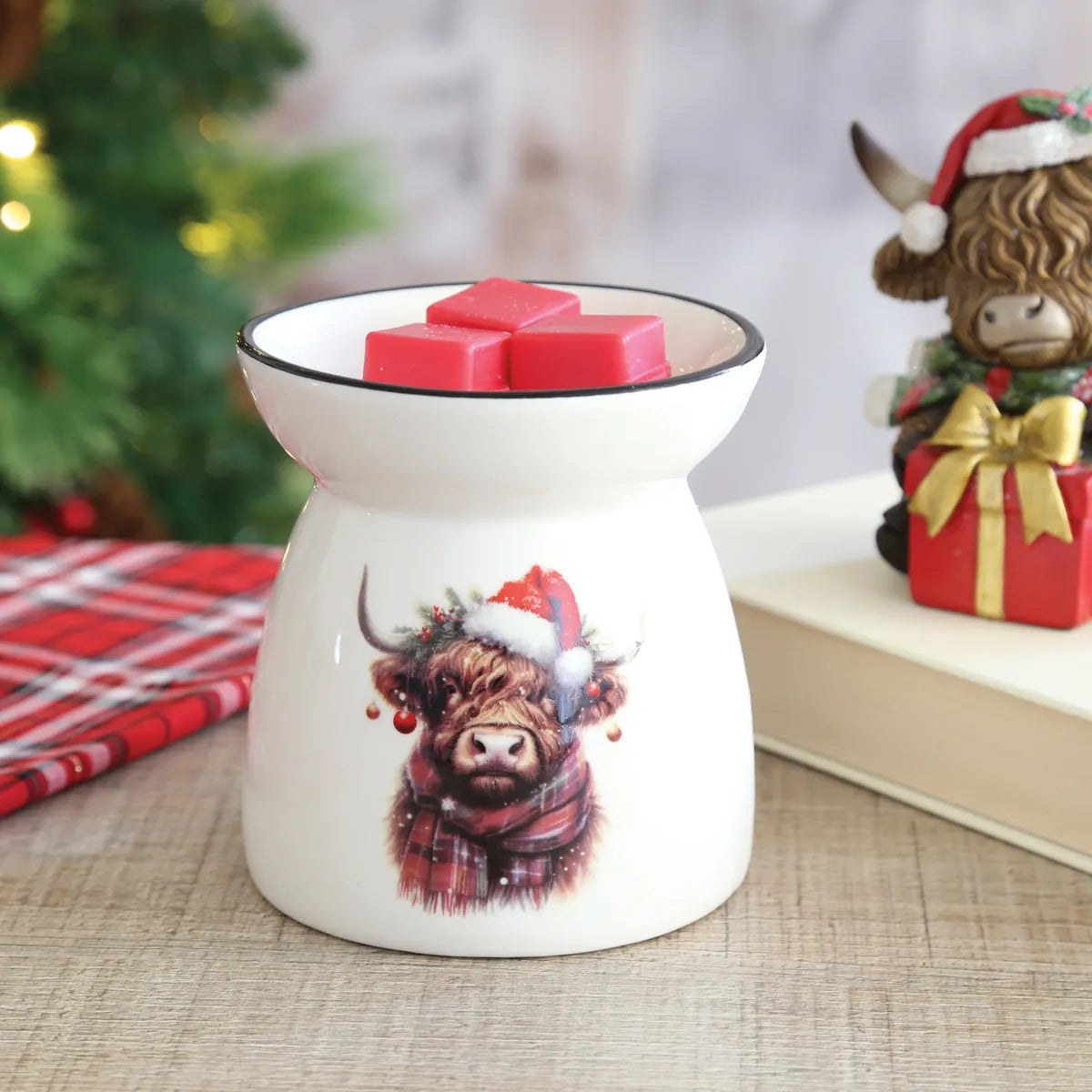 White ceramic Christmas Highland Cow wax warmer for soy wax melts and festive home décor