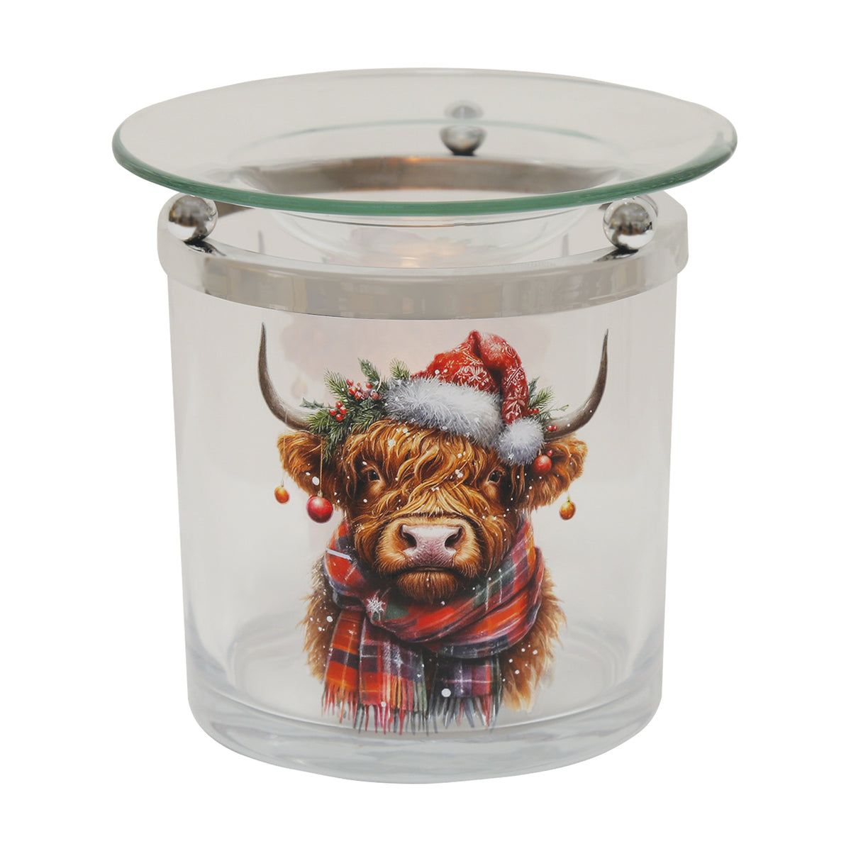 Glass Highland cow Christmas wax warmer lit by a tealight, showing the cow artwork