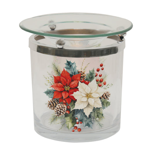 Poinsettia glass wax melt burner with red wax melts in the glass dish, on a festive table with pine cones