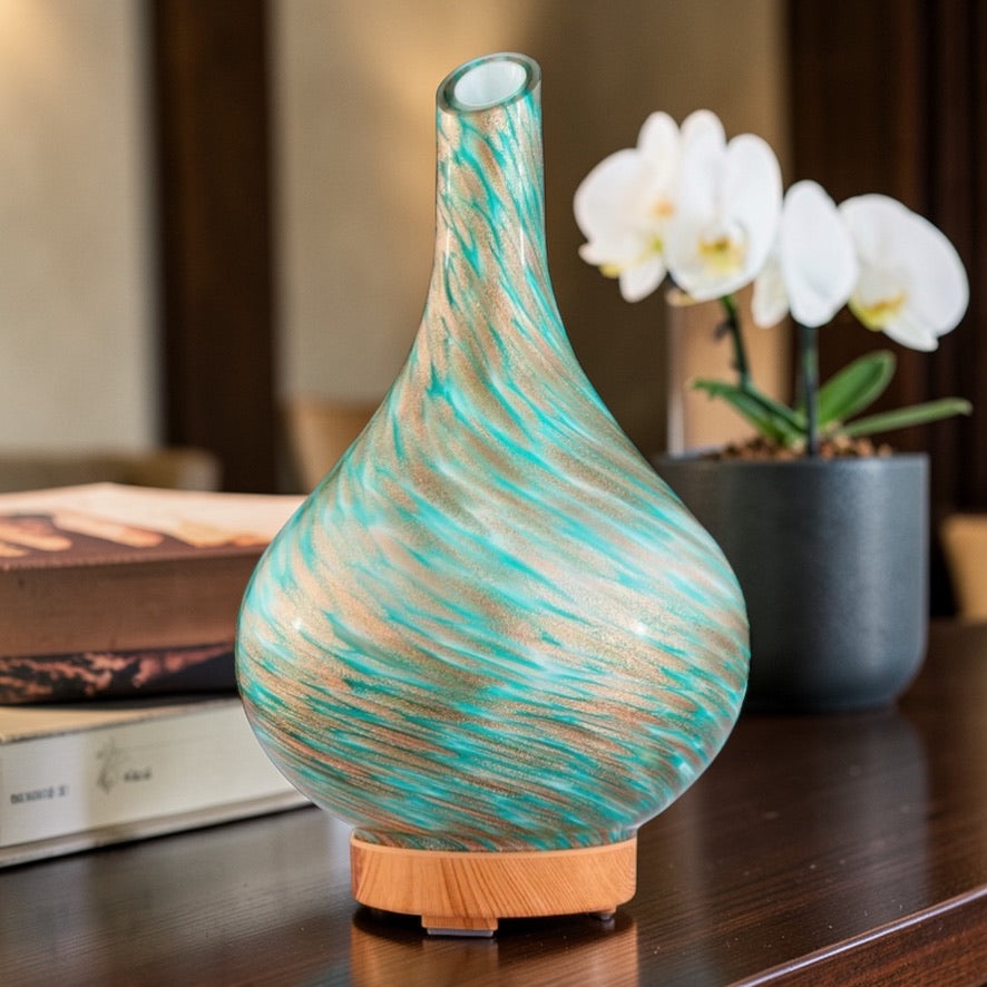 blue ultrasonic aroma diffuser releasing mist with essential oils in home setting