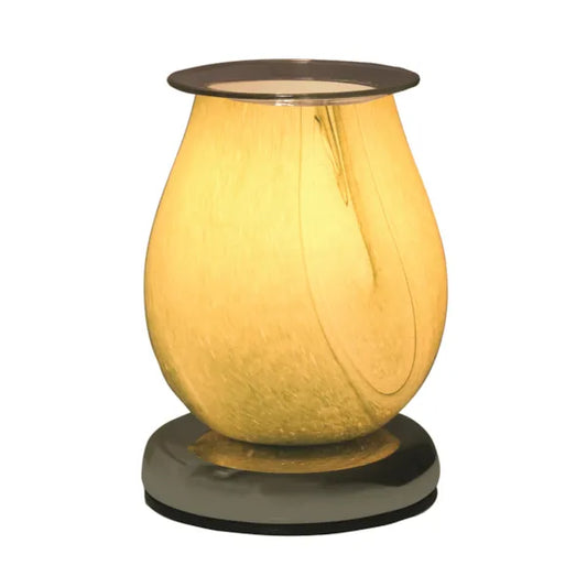 The green wax melt burner glowing warmly while filling the room with fragrance.
