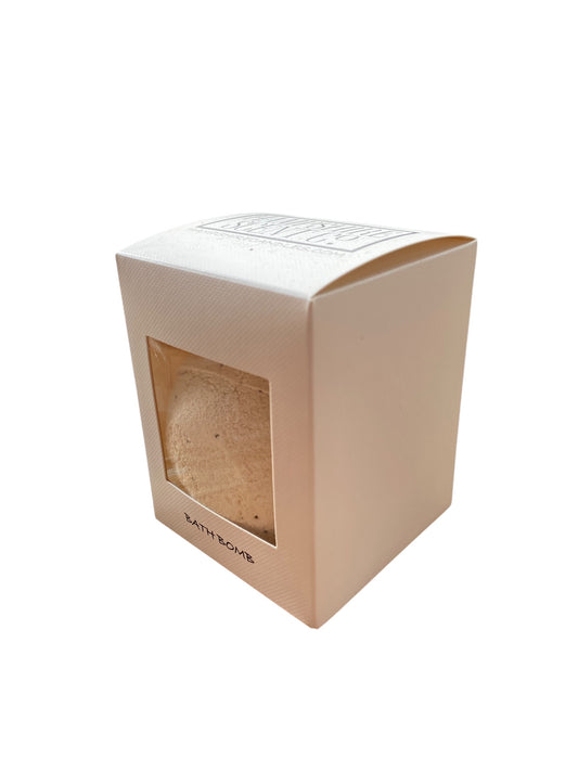 Fizzy vanilla bath bomb dissolving in water, creating gentle swirls and a sweet, calming aroma in the bath.

