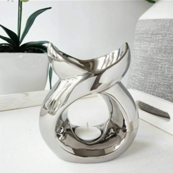 Chrome wax melt burner with modern sculpted design, elegant hand-finished wax melter and oil warmer for home fragrance