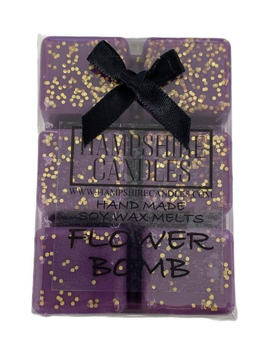 Flower Bomb Wax Melts in Burner – A wax melt dissolving in a burner, releasing a luxurious and long-lasting floral scent.
