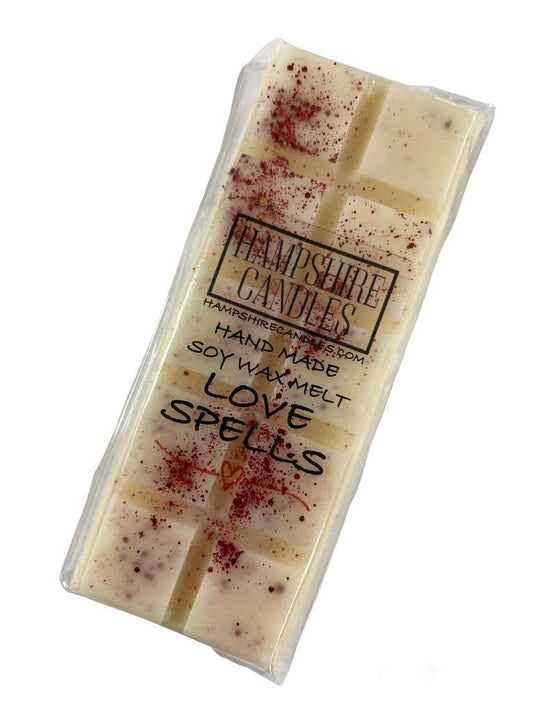 Love Spells scented wax melts in a decorative dish, featuring a romantic blend of peach, cherry blossom, and jasmine.