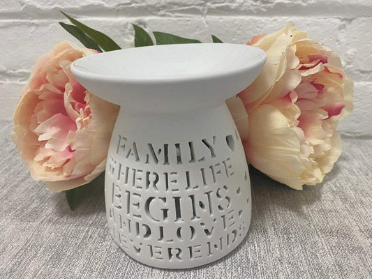 White ceramic wax melt burner with "Family Where Life Begins and Love Never Ends" quote. Ideal for wax melts and essential oils, perfect for home fragrance and aromatherapy.