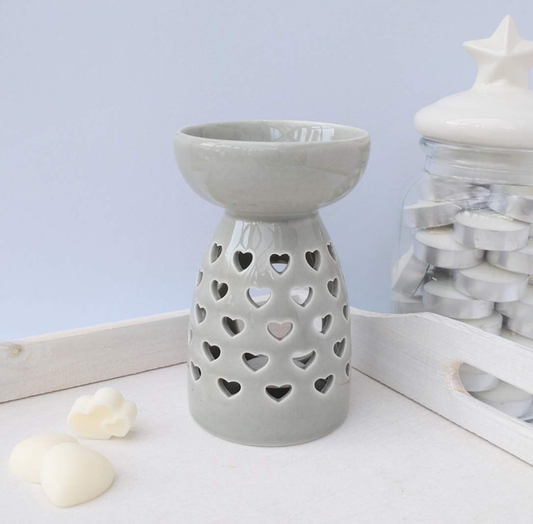 Grey ceramic wax melt burner with heart cutouts and glossy finish